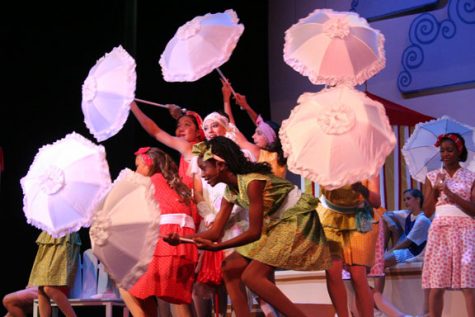 A BALANCED Equation Sing-along lyrics, a strong female lead, and a large chorus equal the perfect eighth grade musical. Julia Pasquinelli and other girls perform the Sur La Plage dance.