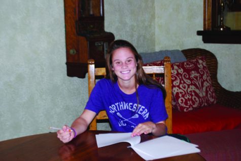 PLEDGING WILDCAT After a year of verbal committment, Maggie signed to Northwestern on November 10th. Photo provided by Maggie