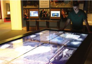 THE DECISION TABLE The most notable feature of the center is a giant interactive display table where visitors can gain insight into the decisions of the Bush administration. Photo by Anisha