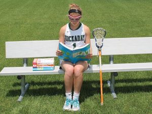 STUDYING ON THE SIDELINES Athletes cram in study sessions inbetween games. Photo by Alaina