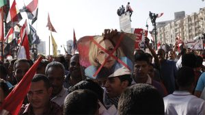 CAPTION: FEELING THE WRATH Egyptians in Tahrir Square, Cairo, protest with Ambassador Anne Patterson’s face X-ed out on posters, opposed to U.S. policy in Egypt, as Egyptian President Mohammed Morsi’s popularity waned. PHOTO  PROVIDED BY DAILY BEAST 