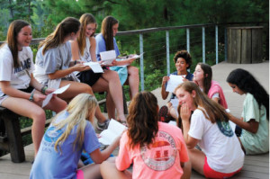 Letters to self: Seniors open the letters they wrote to themselves their freshman year three years later at Allaso Ranch. PHOTO BY ANA ROSENTHAL