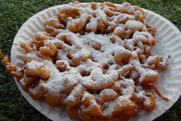 DELICIOUS FARE The funnel cakes at the State Fair of Texas cannot be missed. Enjoy them plain or with a variety of toppings. Photo by Erin  Thomas 