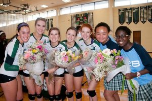 SPIRIT NIGHT Senior volleyball players (L to R) Lily Guevel, Madison Kaminski, Allie Love, Kelsey Powell and Christine Smith with senior managers Ashley Grey and Praise Owoyemi on senior night. Photo provided by Susan Kaminski