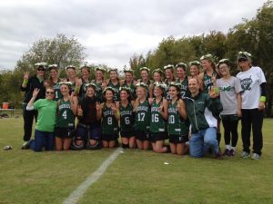 KILLER DAISIES The Hockaday Varsity Field Hockey team won third place at SPC. They pose in their daisy wreaths along with Headmistress Kim Wargo and Upper School Head John Ashton. Photo provided by Sarah Wechsler