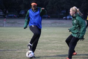 SPRINTING TO THE GOAL  Junior Mimi Asom (L) is being recruited by Divison I schools for soccer. PHOTO BY CLAIRE FLETCHER