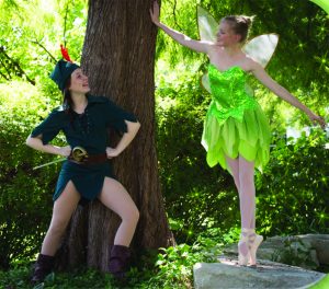 CAPTION: FLY TO NEVERLAND Senior Kathryn Shultz as Peter Pan and Senior Ripley Mayfield as Tinkerbell pose in Neverland’s woods.