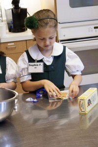 GIVE ME S'MORE Primer student Sophia Fagelman cooks up a storm in the Lower School Rotunda Learning Kitchen. Photo by Grace Voorheis