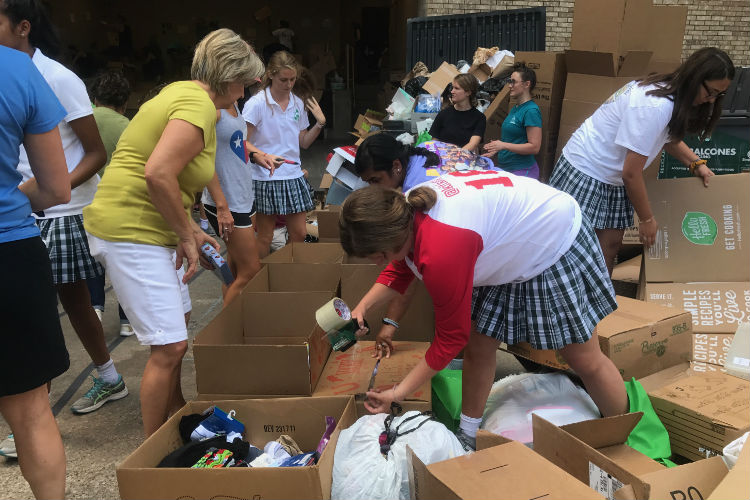 Senior Katherine Pollock and other Hockaday students help sort donations with the Trusted World Organization