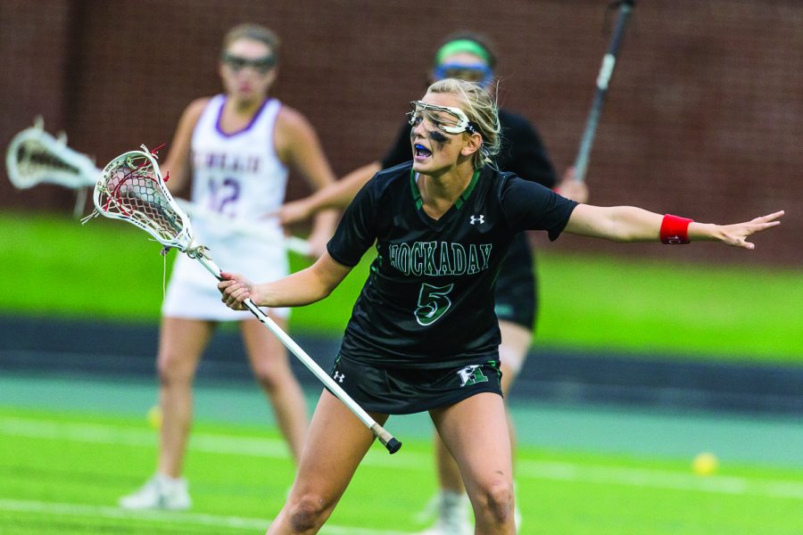 Junior Landry Grover plays a game of lacrosse. Currently, Grover is committed to the University of Denver. She says she is both excited and nervous to play on the collegiate level. photo provided by Landry Grover
