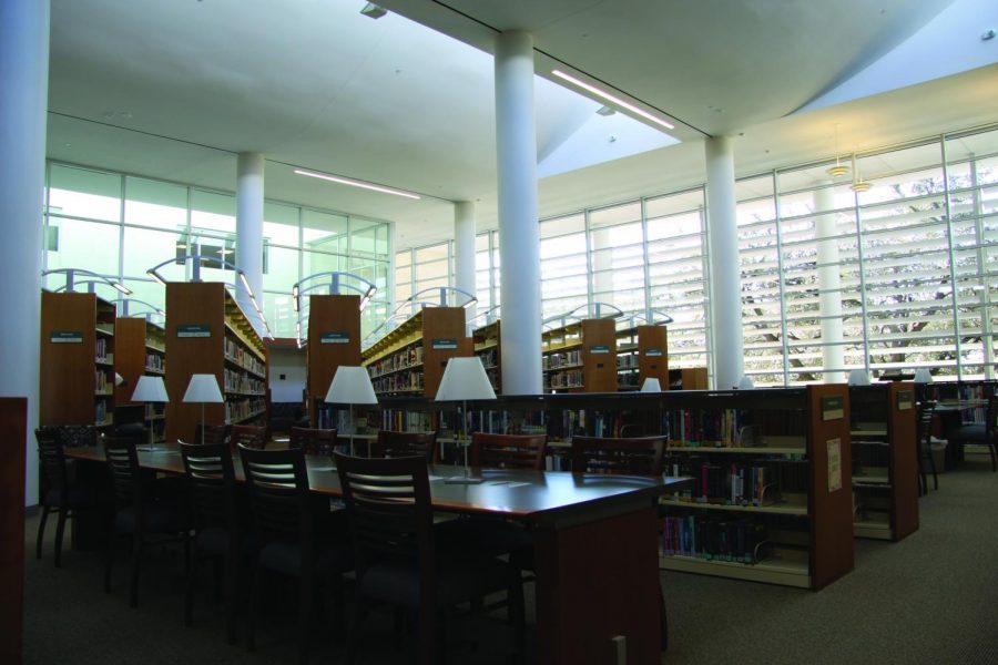 A vacant table sits in the middle of the large, empty library. With its closure due to COVID-19, students are no longer allowed to use the space to sit and do work or browse the shelves for books. “I really miss being able to use the library as a quiet and calm place to stay focused and study,” junior Elise Little said.
