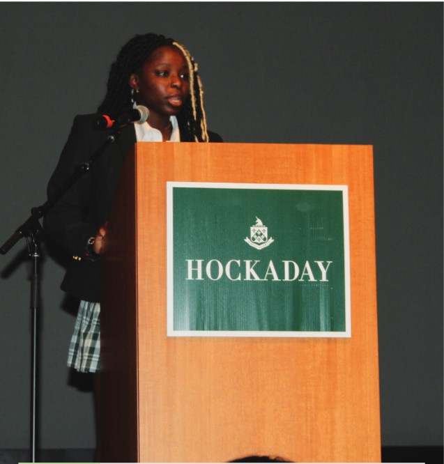 Financial Officer and Parliamentarian, Princess Ogiemwonyi, explains the new changes to the constitution at the Upper School welcome back assembly.