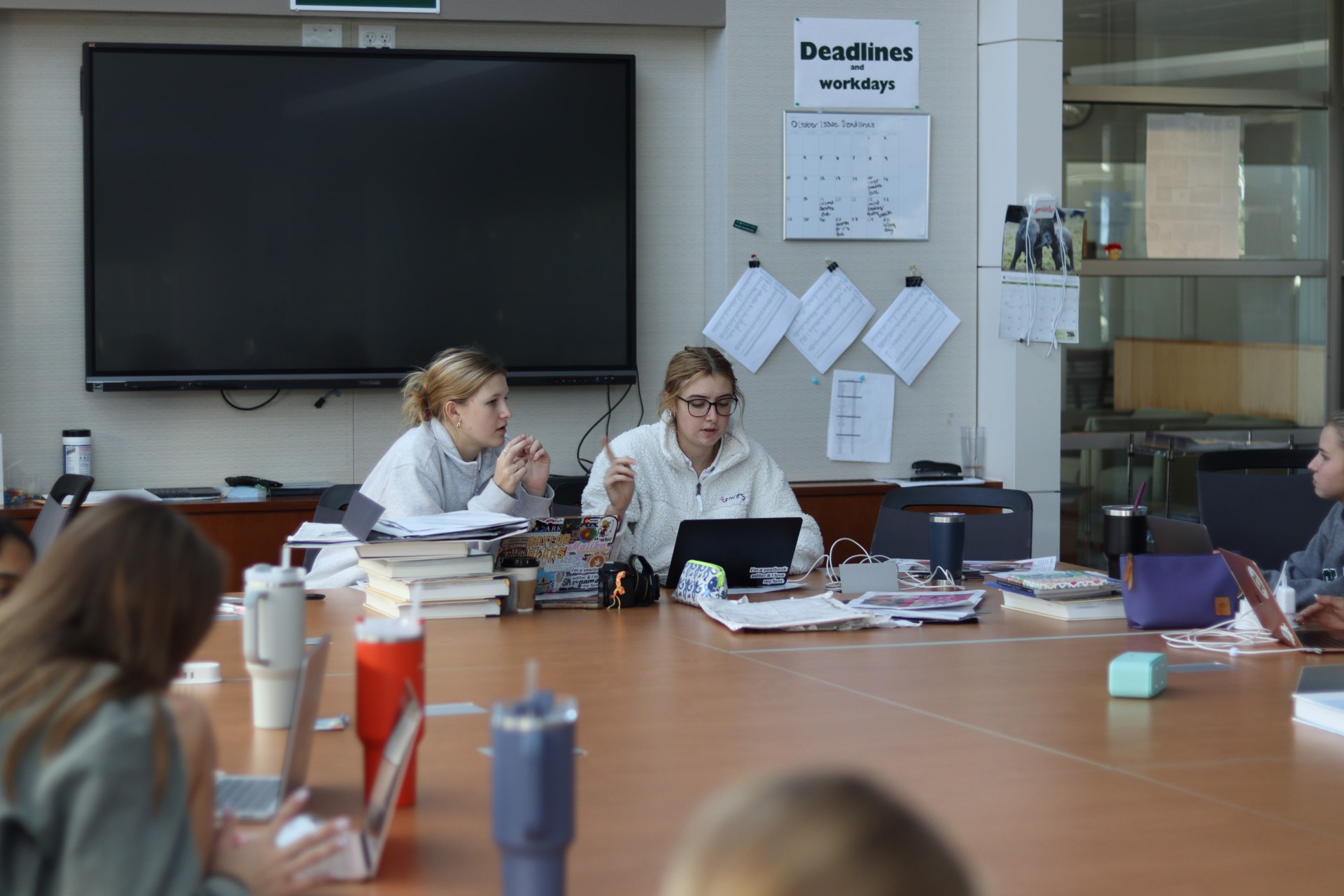 The Cornerstones Editors-in-Chief brief their classmates on plans for an upcoming spread.