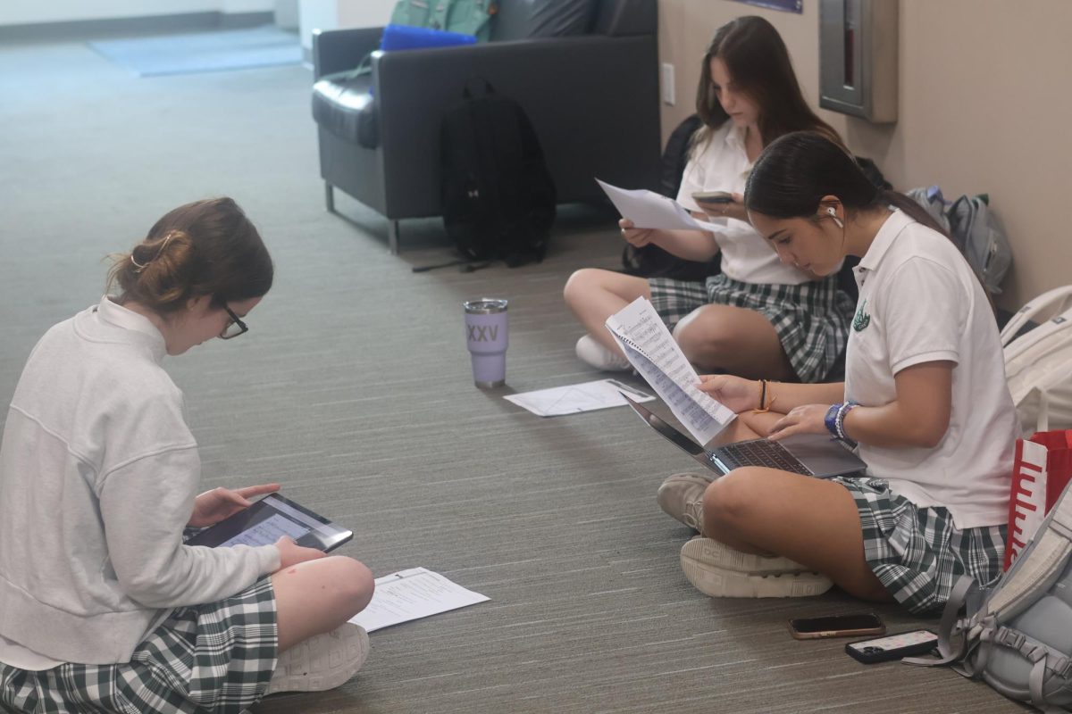 Students prepare for their auditions outside of the theater.