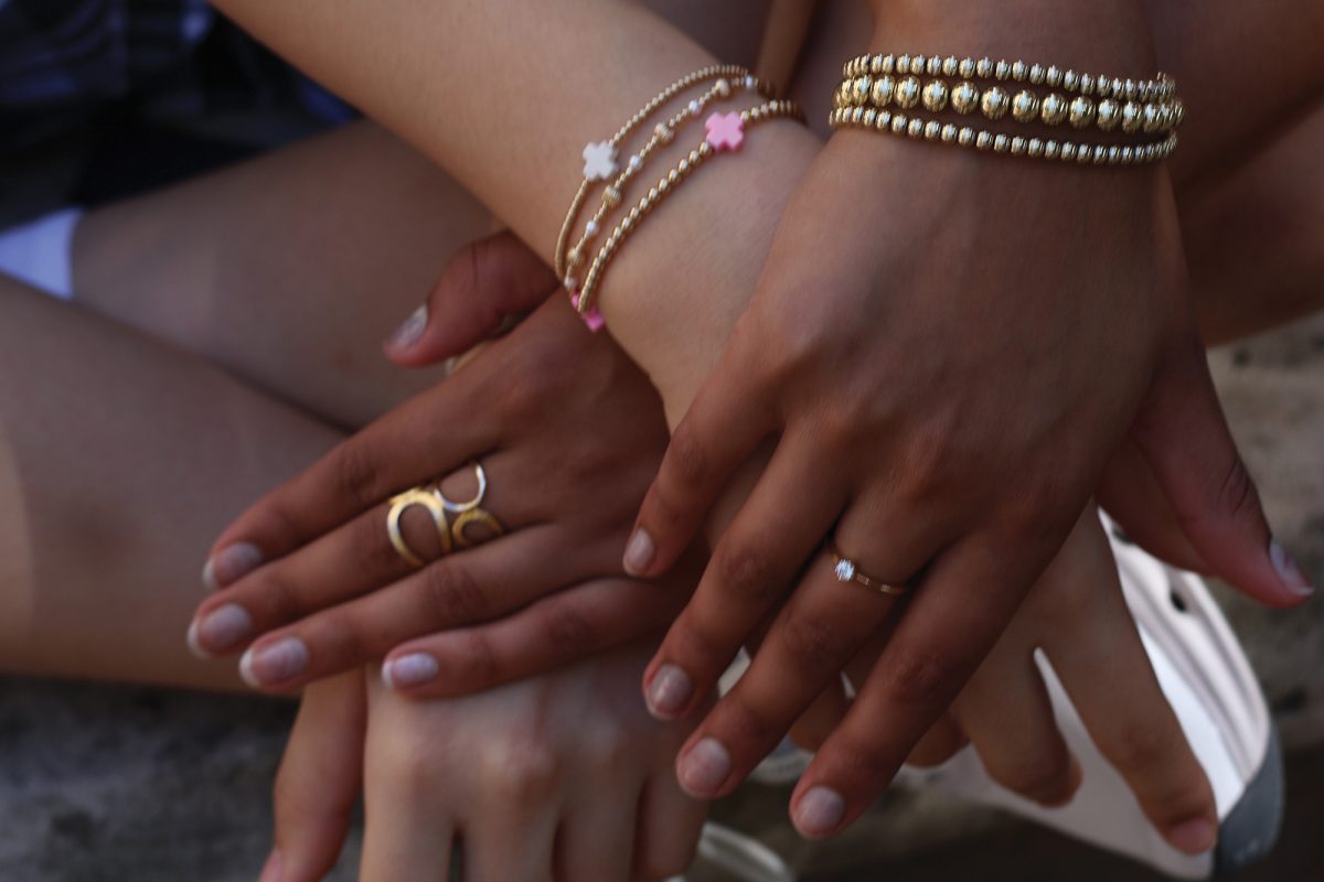 Sophormores Betty Liu and Sanjana Rajagopalan show off the jewelry they wear.