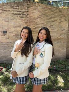 Seniors Aynalie Charron and Jordan Lacsamana pose in their new white blazers at the Class of 2025's Ring Day.