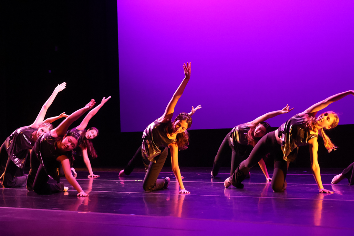 Junior Peyton Johnson dances onstage.