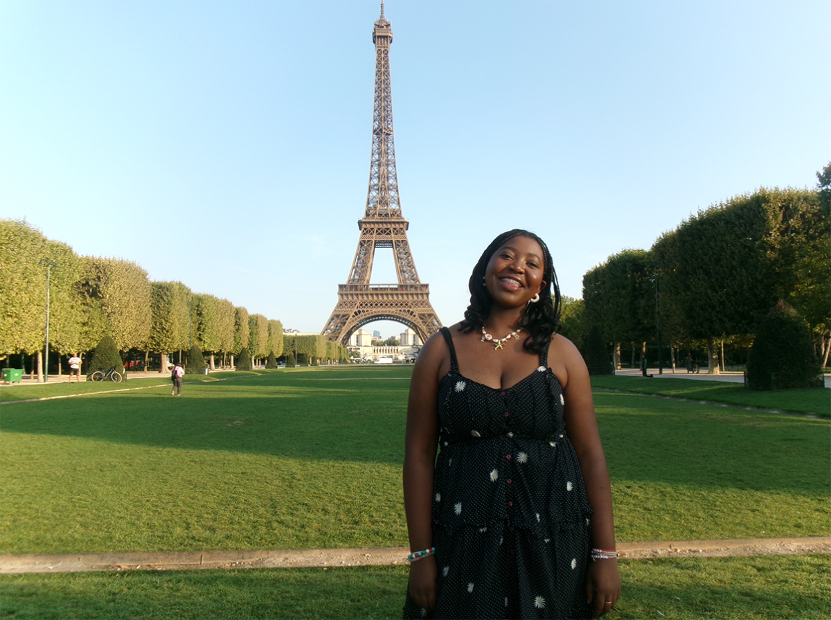 Anashe Barwa '27 in front of Eiffel Tower during her study abroad in Paris, France.