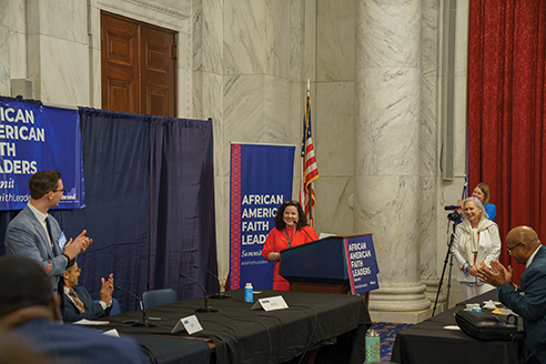 Dean speaks at a summit.