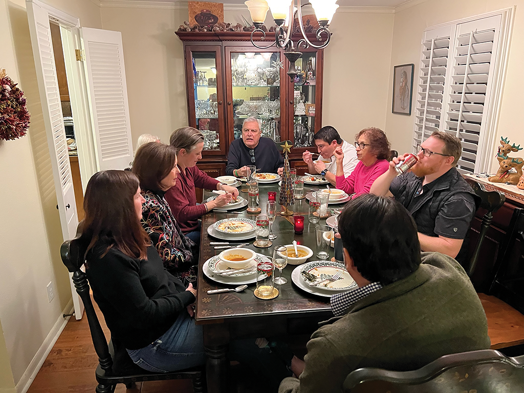 The Ortega family enjoys pozole at Christmas Eve dinner.
