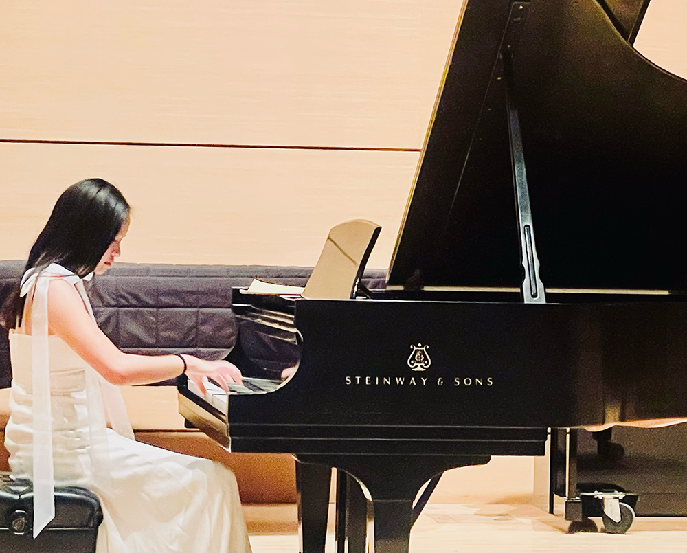 Junior Kaitlyn Ouyang performing piano during the Texas State International Concerto Competition