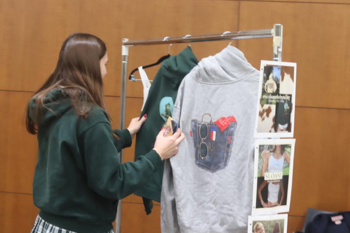 'Sloane the Brand' hoodies and tank showcased at Social Impact Bazaar