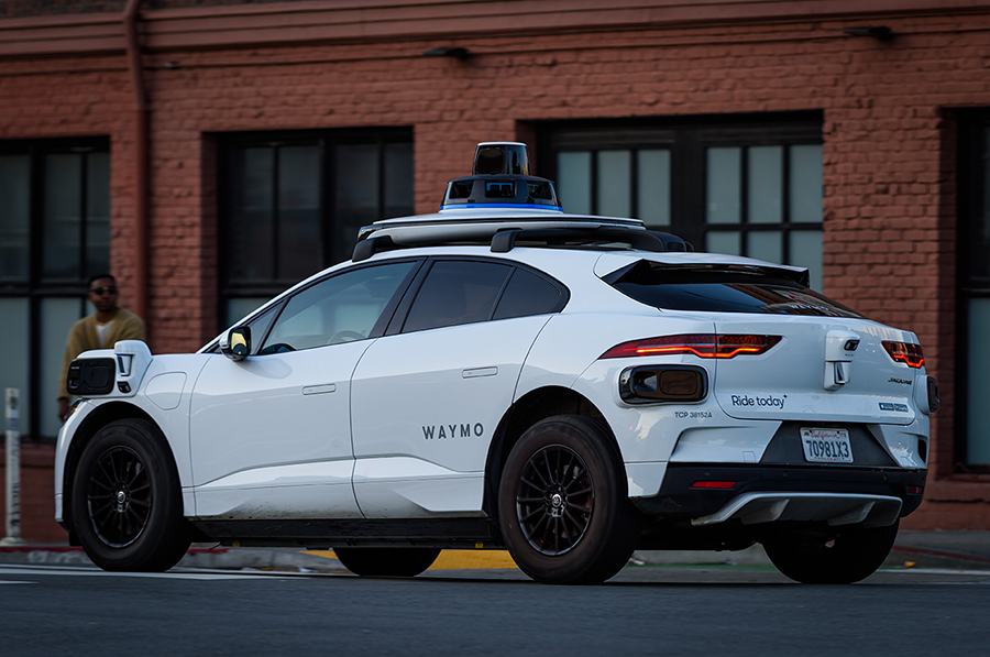 Waymo car driving on roads
