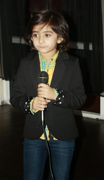 Desai at four years sings a Bollywood song for a New Years party.